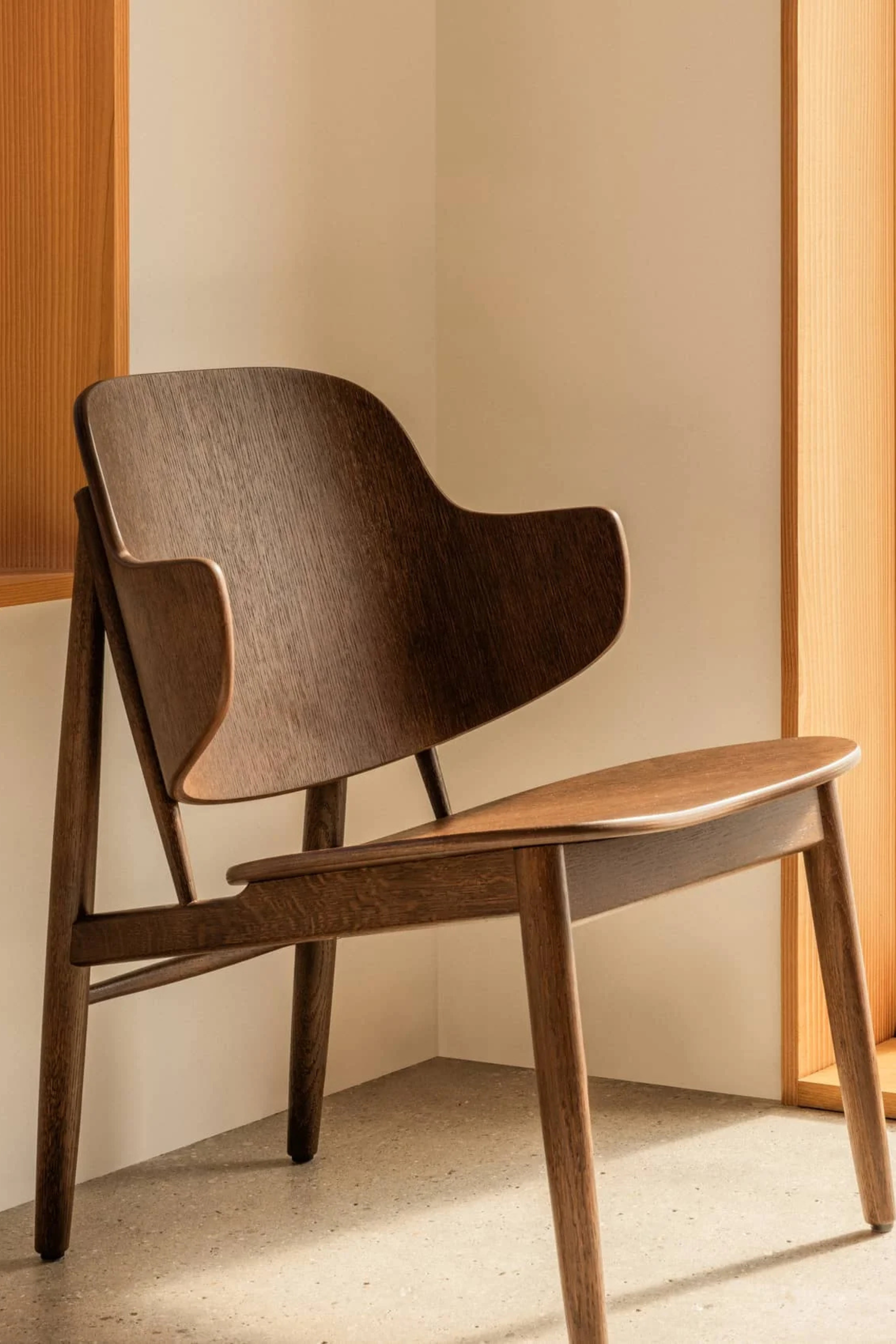 The Penguin Wooden Lounge Chair, red stained oak