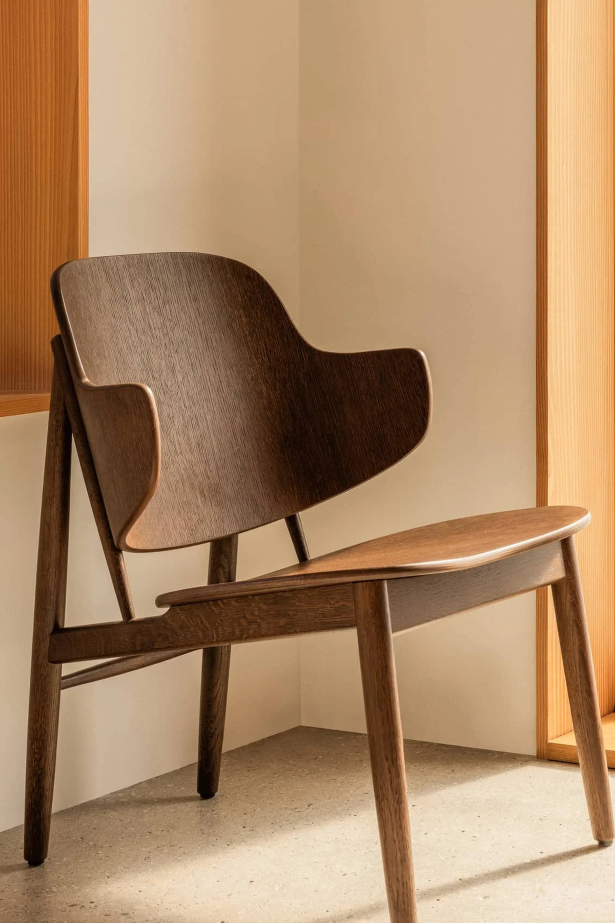 The Penguin Wooden Lounge Chair, red stained oak